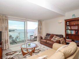 A living room with a view of the sea at 6 Avon Quillet Bigbury-On-Sea