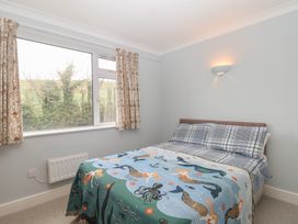 A bedroom with a bed and window at 6 Avon Quillet Bigbury-On-Sea