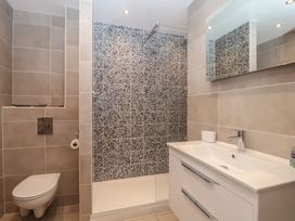 A bathroom with a shower and sink at 6 Avon Quillet in Bigbury-On-Sea