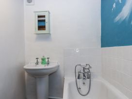 A bathroom with a sink and bathtub at Swallows Nest Widecombe-in-the-Moor near Postbridge