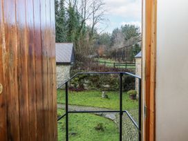 A view from a balcony looking at a garden at Swallows Nest in Widecombe-in-the-Moor near Postbridge