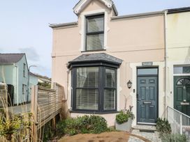 A house exterior with a door and window at Bryn Y Mor Beaumaris