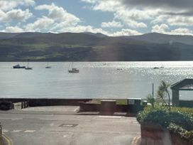 A view of boats on water with mountains in the background at Bryn Y Mor Beaumaris
