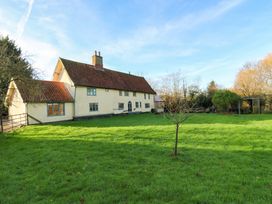 A house with a garden and grass at Town Farm in 