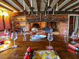 A dining room with a large table set for a meal at Town Farm