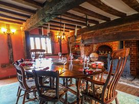 A dining room with a large table and chairs at Town Farm