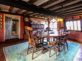 A dining room with a wooden table and chairs at Town Farm