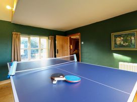 A game room with a table tennis table and a painting at Town Farm