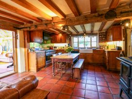 A kitchen with a table and benches at Town Farm in 