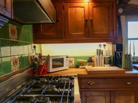 A kitchen with appliances and utensils at Town Farm