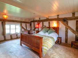 A bedroom with a bed and lamps at Town Farm
