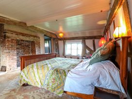 A bedroom with a bed and lamp at Town Farm in 