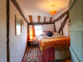 A bedroom with a bed and window at Town Farm