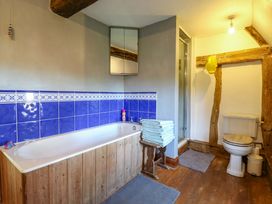 A bathroom with a bathtub and shower at Town Farm in 