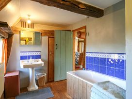 A bathroom with a sink and bathtub at Town Farm in 