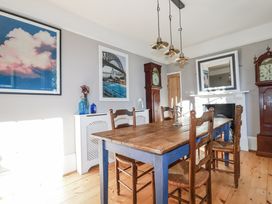 A dining room with a table and chairs at Rosedale in St. Ives