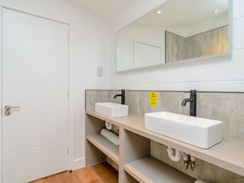A bathroom with two sinks and a mirror at The Elton in Kings Cliffe