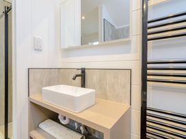 A bathroom with a sink and mirror at The Castor in Kings Cliffe