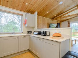 A kitchen with a sink, toaster, and bread at The Sutton (Pet) in Kings Cliffe