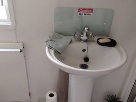 A sink with a towel and soap at No. 30 First Avenue, Rhyl