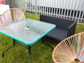 A table and chairs in a garden at No. 30 First Avenue, Rhyl