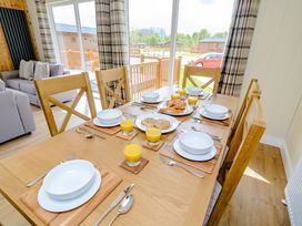 A dining room with a table set for breakfast at The Yarwell in Kings Cliffe