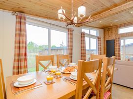 A dining room with a table set for breakfast at The Wansford in Kings Cliffe