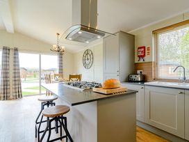 A kitchen with a stove and sink at The Yarwell (Pet) in Kings Cliffe