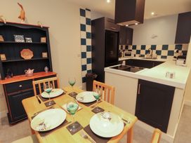 A kitchen with a dining table set at 20 Lorton Street in Cockermouth