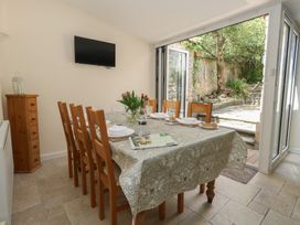 A dining room with a table and chairs at Crantock