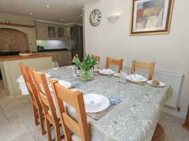 A dining room with a table set for meals at Crantock in 