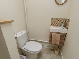 A bathroom with a toilet and a sink at Crantock