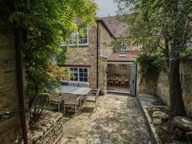 An outdoor dining area with table and chairs at Crantock
