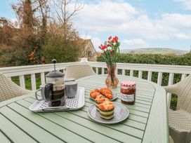 A table with a coffee maker and pastries at Swanage Coastal Park Caravan in Swanage