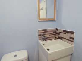 A bathroom with a sink and toilet at Ty Crigyll in Holyhead