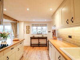 A kitchen with cabinets and a sink at Lake View in Crediton