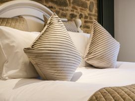 A bedroom with a bed and pillows at Lake View in Crediton