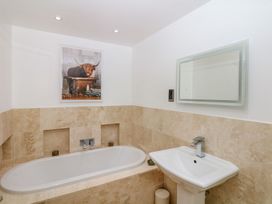 A bathroom with bathtub and sink at Lake View in Crediton