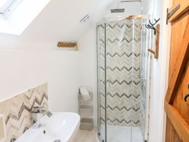 A bathroom with a shower and bathtub at Lake View in Crediton