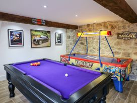 A games room with a pool table and air hockey table at Lake View in Crediton