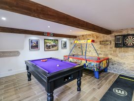 A game room with a pool table and air hockey table at Lake View in Crediton