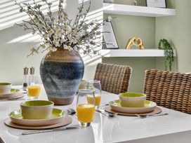 A dining room with a table set for breakfast at Windsor House in York