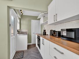 A kitchen with sink and appliances at Windsor House in York
