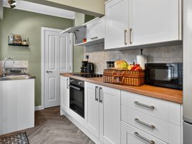 A kitchen with a sink and appliances at Windsor House in York