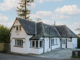A house with a stone pathway and garden at North Cottage Bowness-On-Windermere