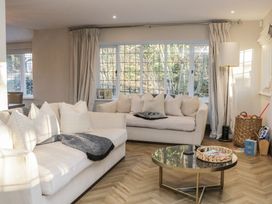 A living room with sofas and a coffee table at North Cottage in Bowness-On-Windermere