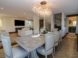 A dining room with a table and chairs at North Cottage Bowness-On-Windermere