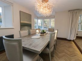 A dining room with a table and chairs at North Cottage in Bowness-On-Windermere