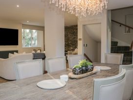 A dining room with a table and chairs at North Cottage Bowness-On-Windermere