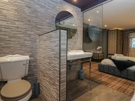 A bathroom with a toilet and sink at North Cottage Bowness-On-Windermere
